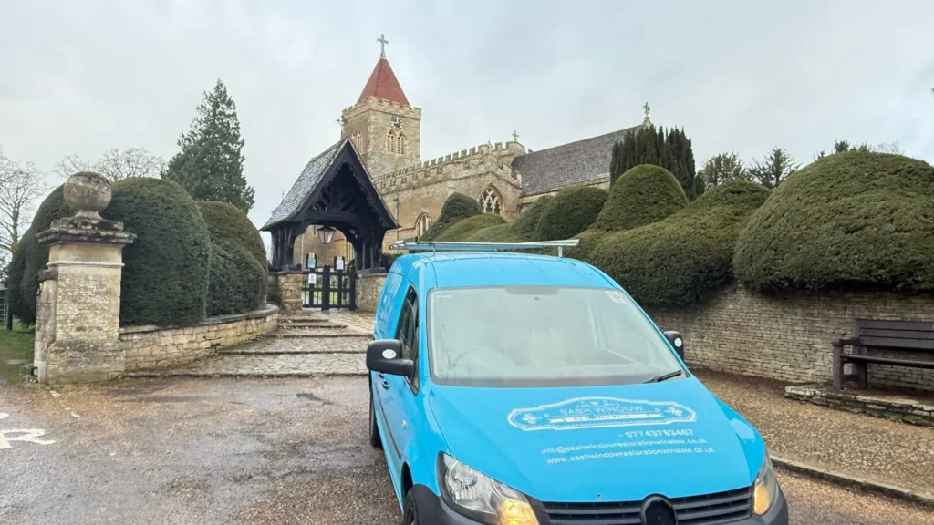 Sash Window Restoration Turvey van parked outside All Saints Church