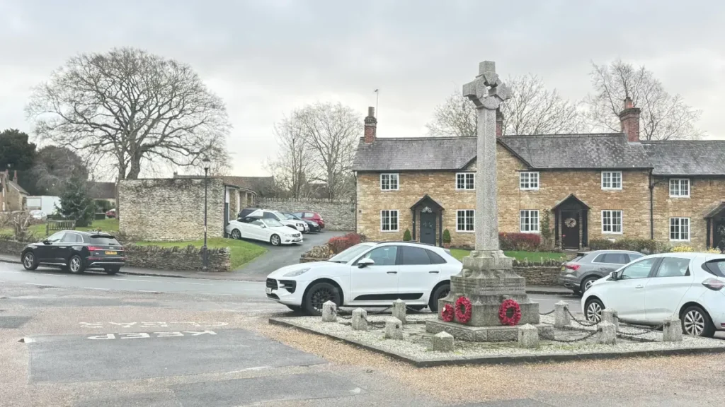 Turvey War Memorial and historic stone cottages, a conservation area covered by sash window restoration services in Olney, Milton Keynes and Bedford.